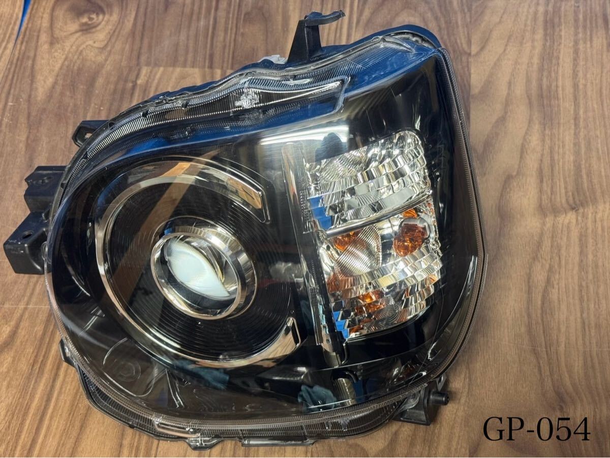 054【ダイハツ:ミラトコット】 左ヘッドライト ※佐川急便発送着払い ※作動未確認 ※業販向け拍卖