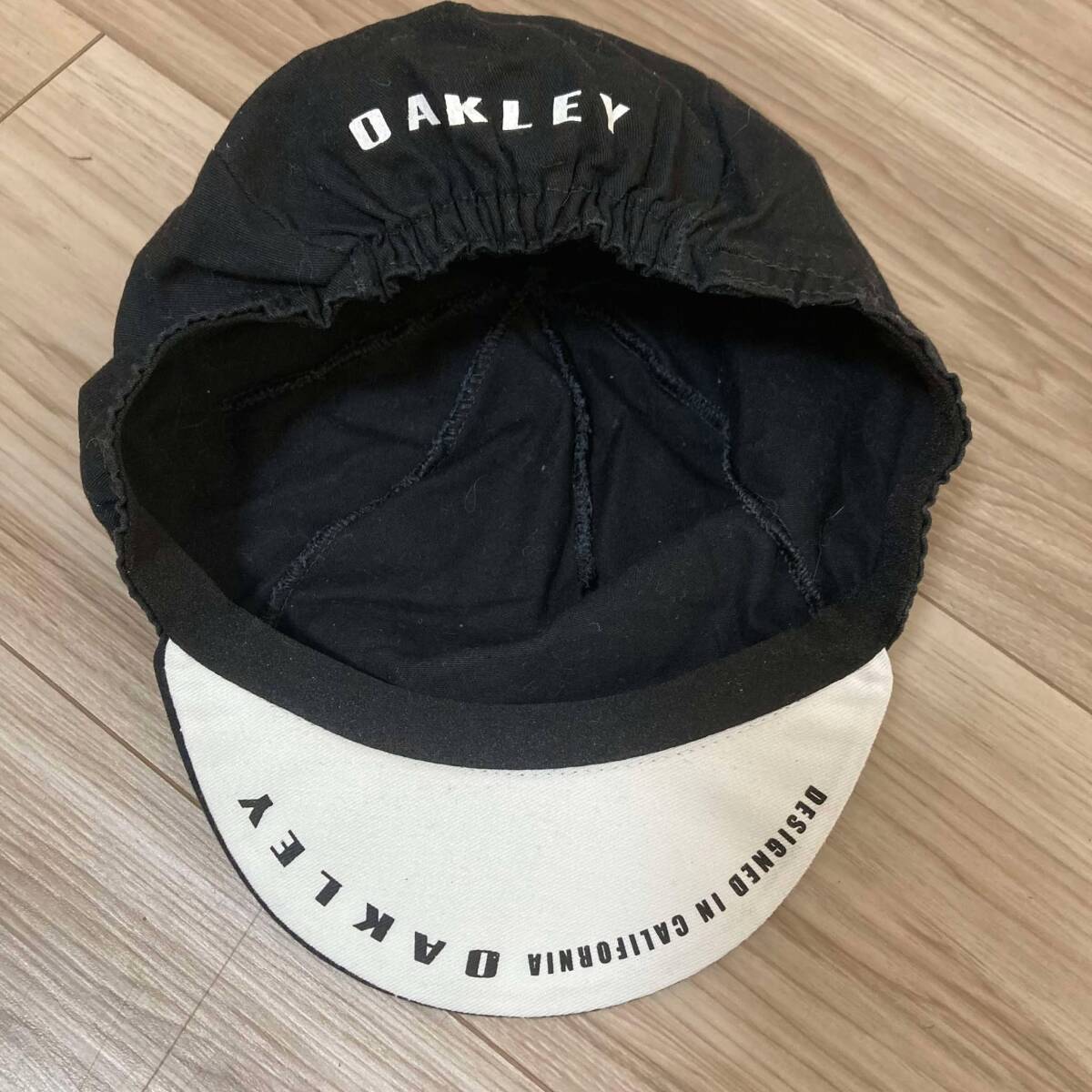 送料230★イタリア製 オークリー OAKLEY サイクルキャップ/ヘルメットインナー ポリエステル65% コットン35% ビッグマーク 良質品 780 黒拍卖