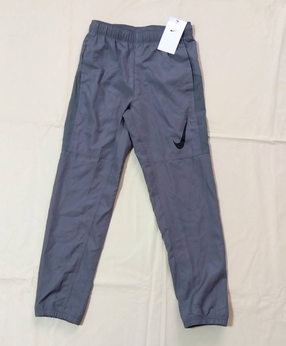 タグ付き 未使用 NIKE ナイキ トレーニングパンツ 長ズボン ロングパンツ 140-150cm 足首ゴム入り サッカー 男の子 7523拍卖