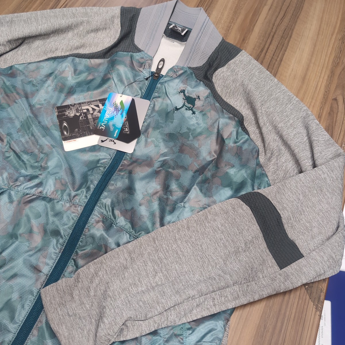 新品 オークリー 人気のスカル 薄手ジャケット サイズXL 定価17600円拍卖