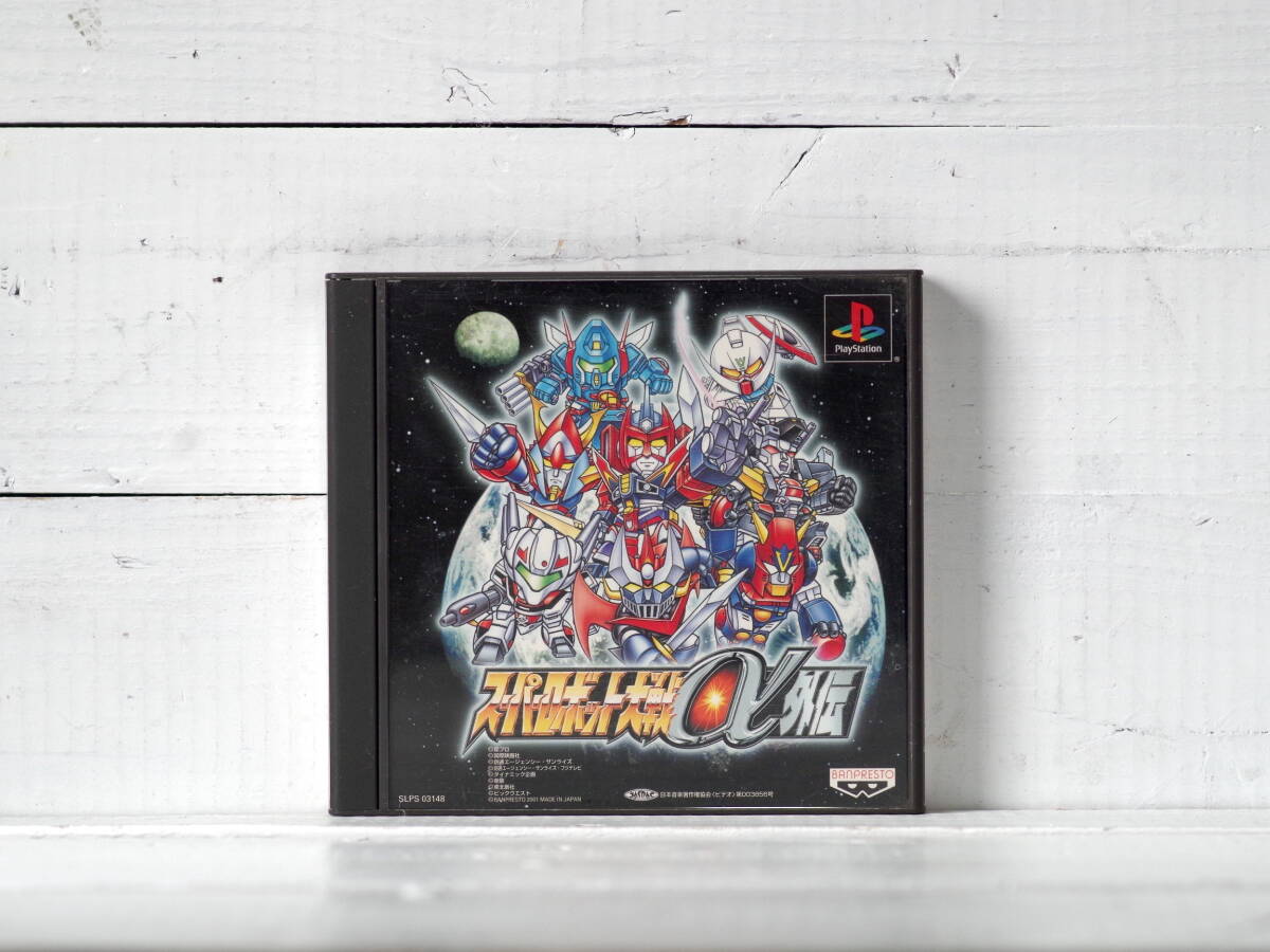 M12419【PS1】アンケートハガキ・印刷物付属 起動確認OK!! スーパーロボット大戦α外伝 盤面キズ多 ゆうメール150g拍卖