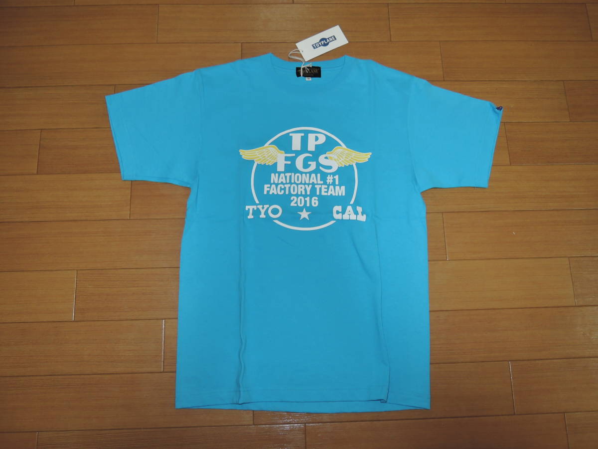 新品 TOY PLANEトイプレーン Tシャツ M 青サ ークルロゴ フラッグ拍卖