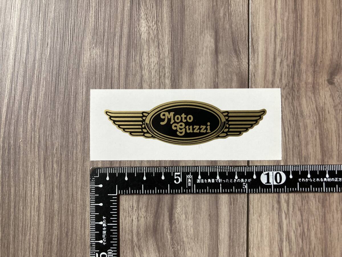 送料無料 Moto Guzzi モトグッツイ ウィング ヘルメット カッティング ステッカー ゴールド 90mm x 25mm拍卖