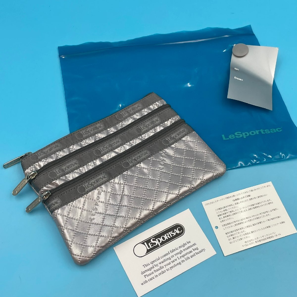 【17686Q026】ポーチ レスポートサック 未使用? 袋付き シルバー 銀 LeSportsac 3段ファスナー 3ZIP 3ジップ コスメティック 化粧ポーチ拍卖
