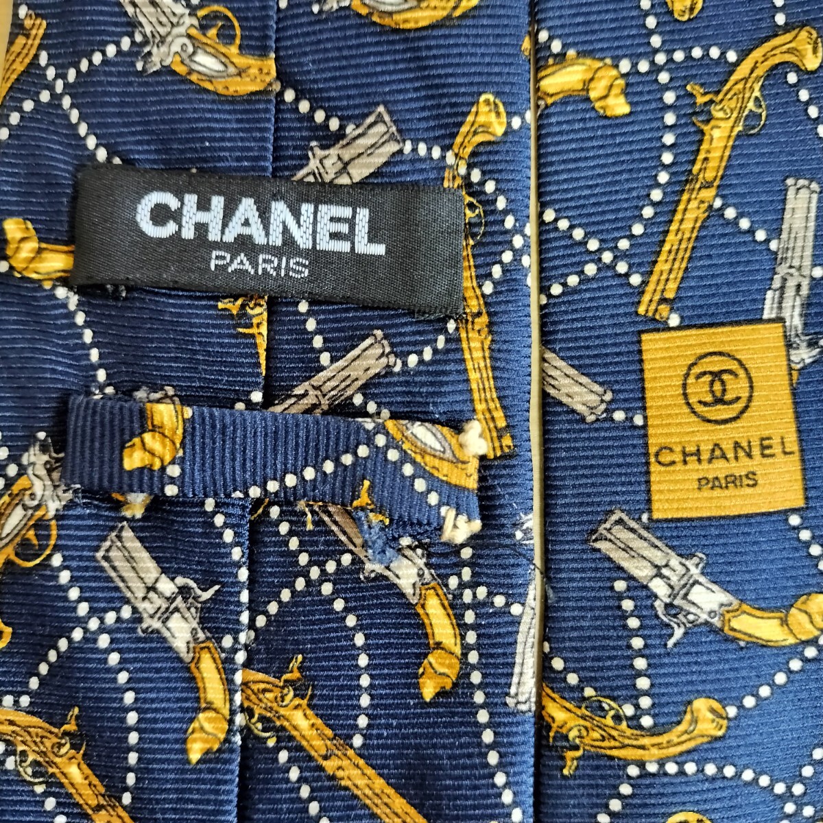 CHANEL(シャネル)紺ゴールド銃モデルガン模様ネクタイ拍卖
