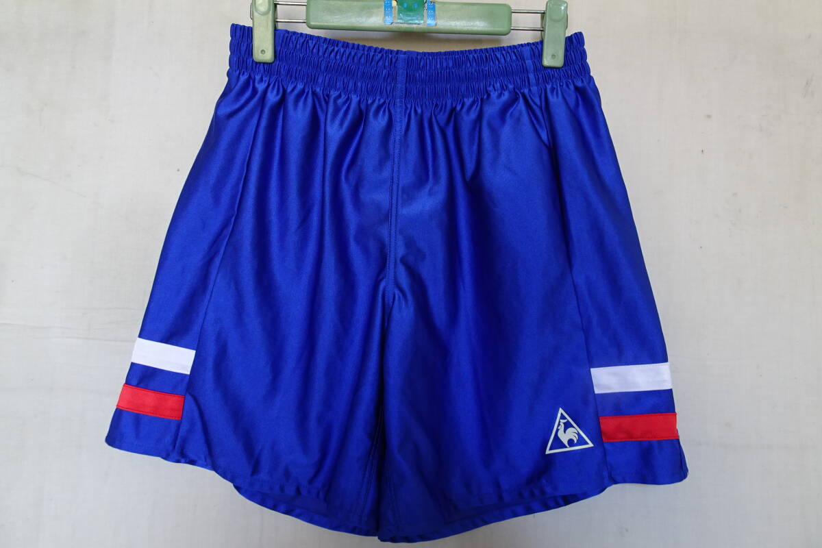 le coq sportif/ルコックスポルティフ/ショートパンツ/光沢感/ひざ上丈/裾サイド白・赤ライテープ/スポーツ/青/ブルー/Oサイズ(7/22R7)拍卖