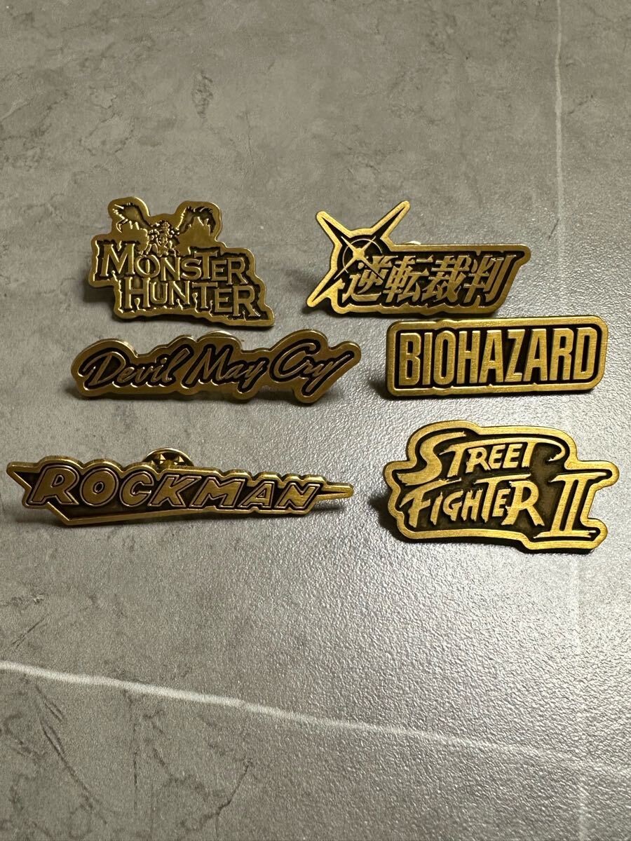 大カプコン展ロゴピンバッジフルセット バイオハザード、ロックマン、モンスターハンター、逆転裁判、デビルメイクライ等拍卖
