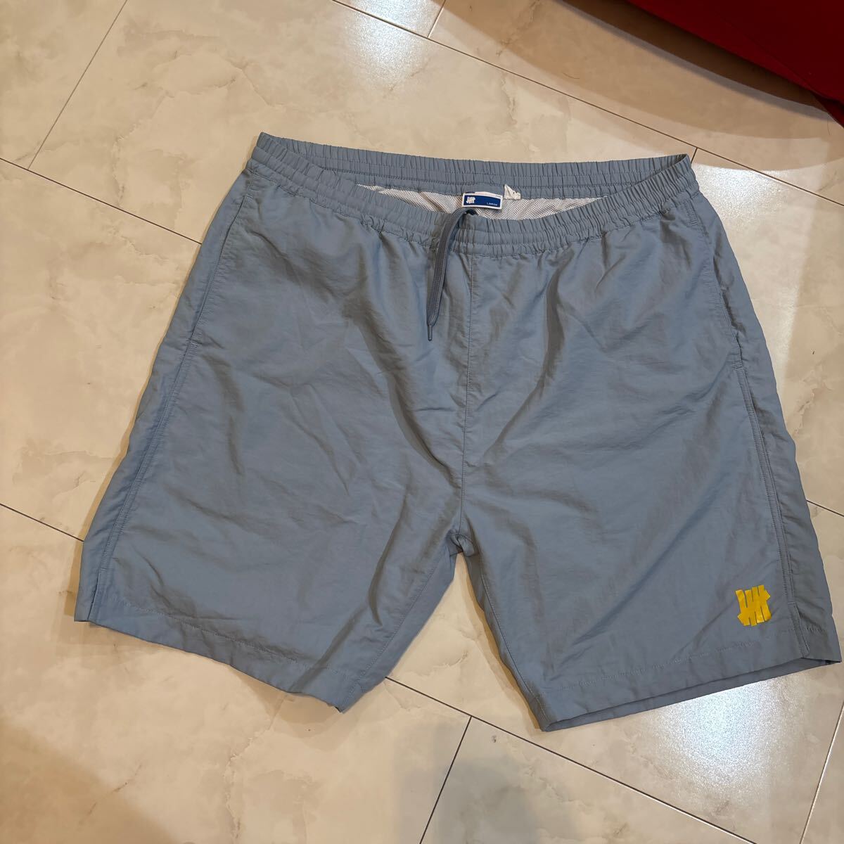 UNDEFEATED アンディーフィーテッド ハーフパンツ ショートパンツ サックス ブルー L拍卖