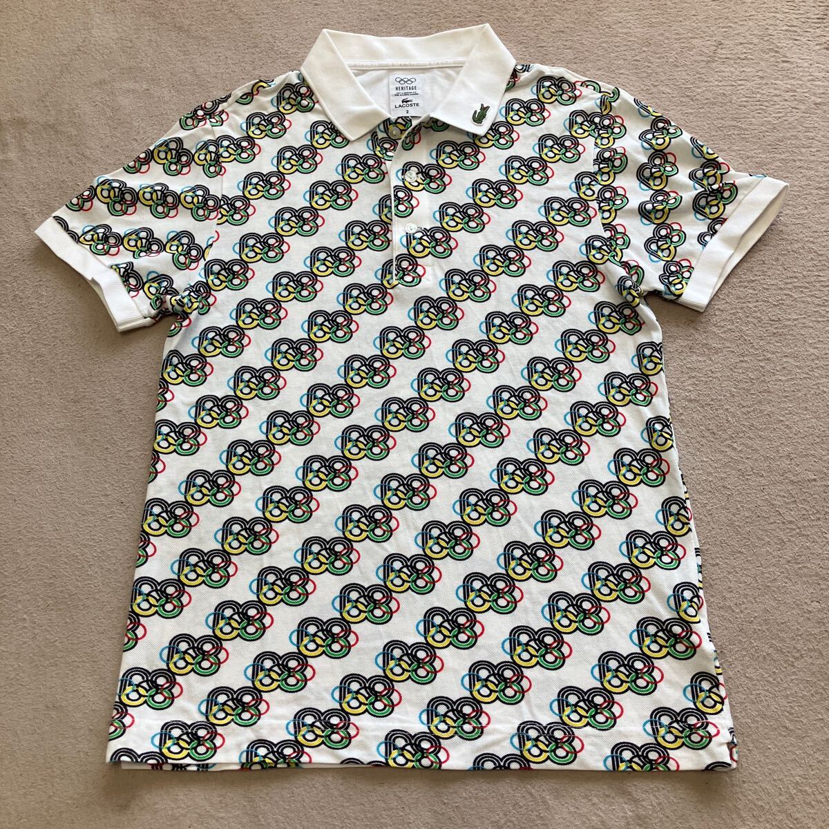 LACOSTE ラコステ HERITAGE OLYMPIC GAMES 総柄 半袖 ポロシャツ サイズ2 ホワイト 美品 バッグ刺繍あり 正規品拍卖