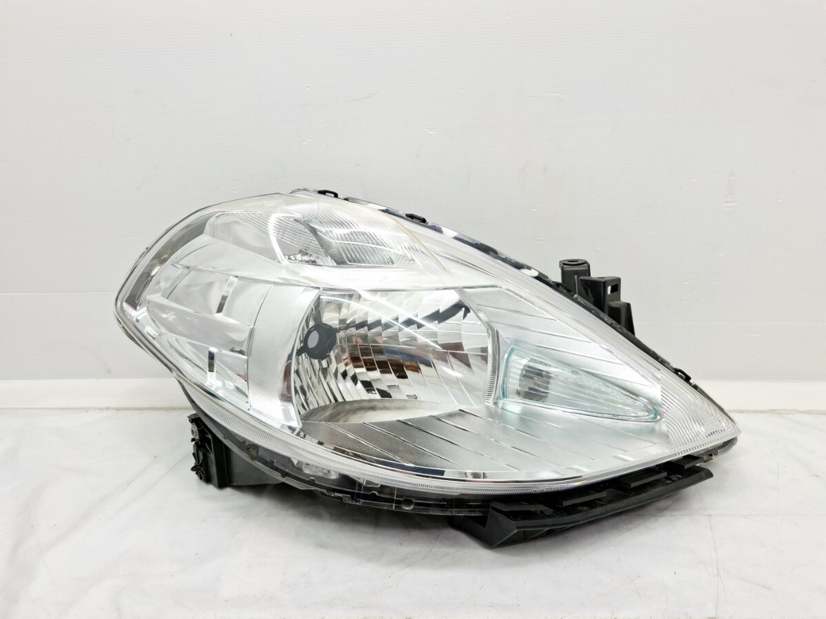 C11 ティーダ 後期 右 ヘッドライト 運転席側 ハロゲン STANLEY P7779 レンズ ランプ A2拍卖