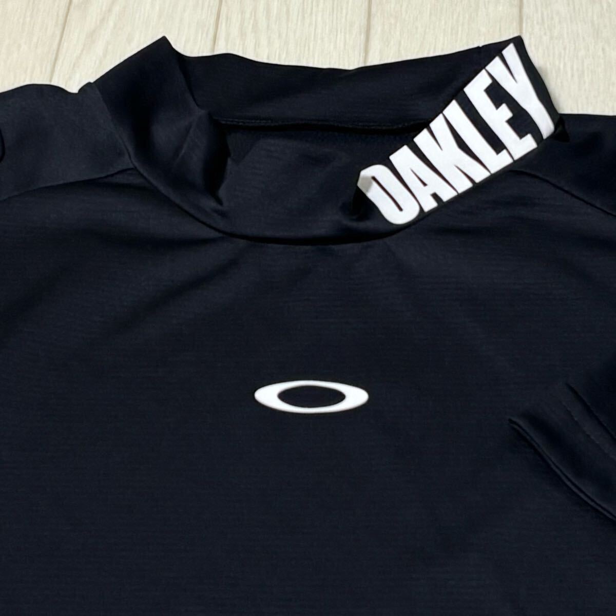 新品★オークリー OAKLEY 襟元ビッグロゴプリント 吸汗速乾 ストレッチ 半袖モックネックシャツ/ブラック/サイズXL/送料185円拍卖