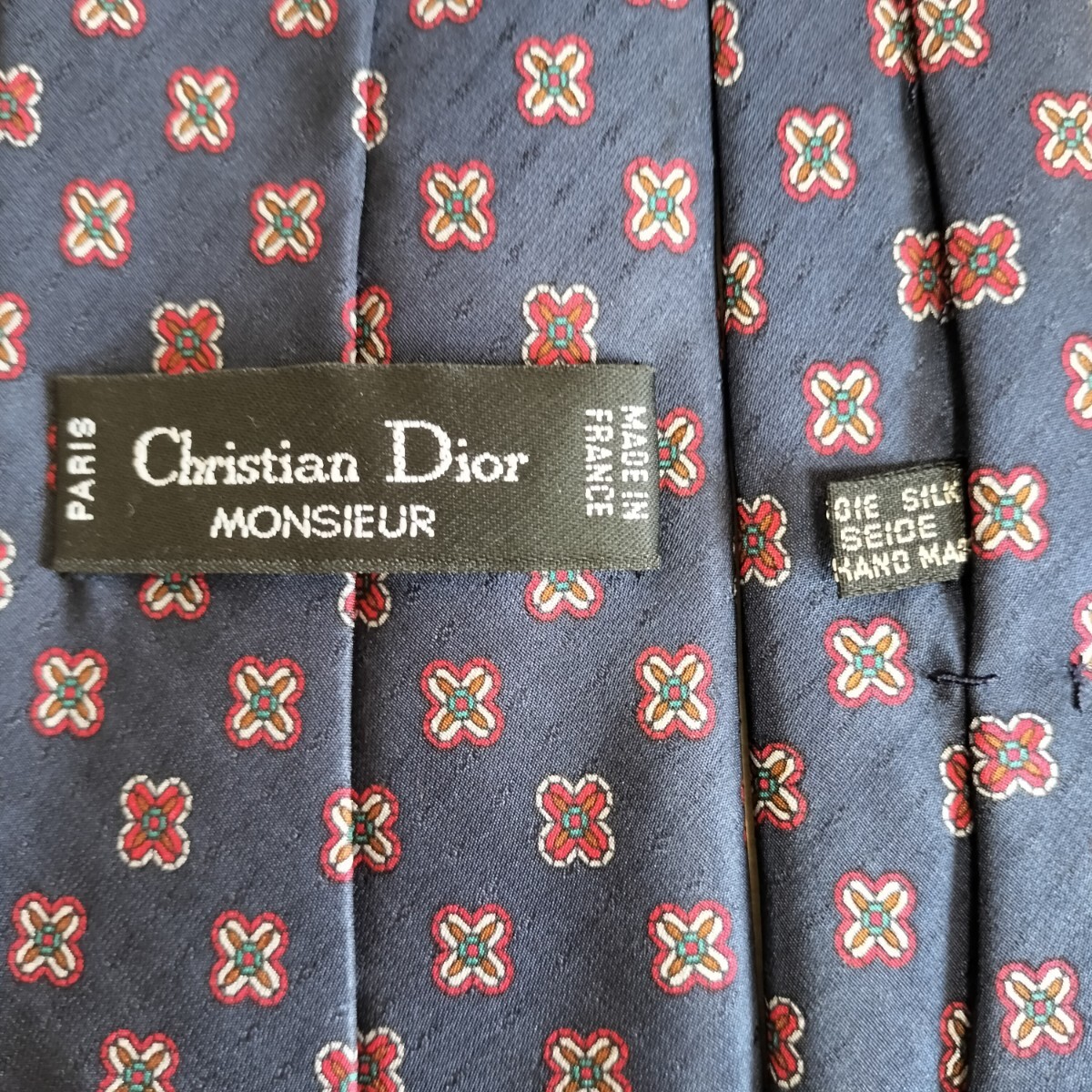 Christian Dior(クリスチャンディオール)紺赤花バツワンポイントトロッター模様ネクタイ拍卖