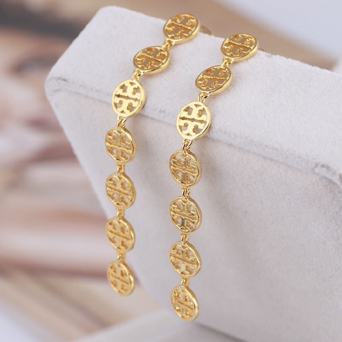 新品未使用 TB039 Tory Burch トリーバーチ ロング 定番ピアス ゴールド拍卖