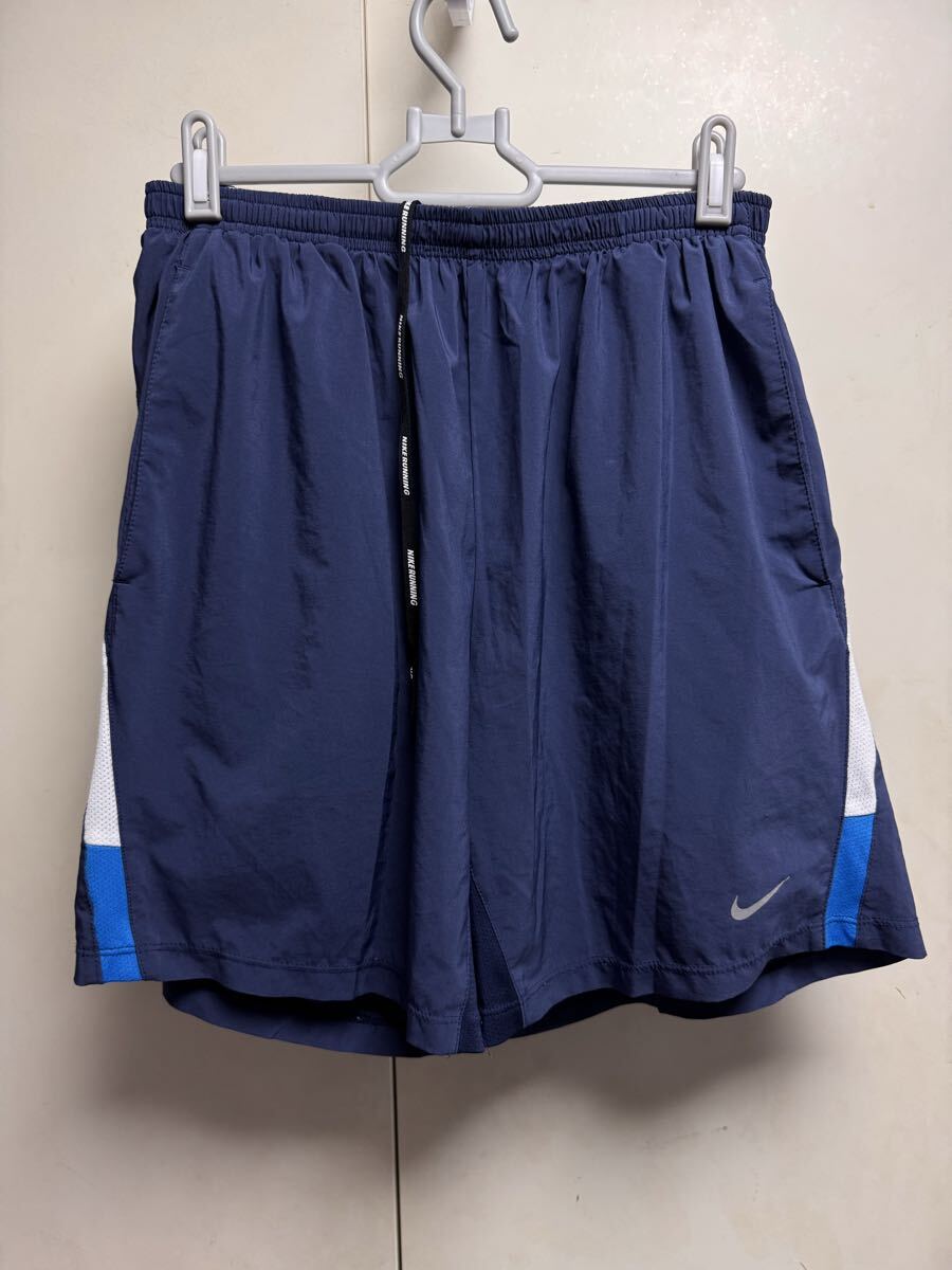 送料格安スピード発送!良品★NIKEナイキランニングパンツインナー付きブルー系白ライン★Lサイズ登山トレランマラソン拍卖