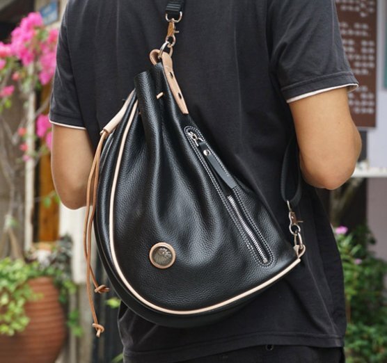 本革のショルダーバッグ男の人の頭の層牛革の男女のアメリカの独特なショルダーバッグ机関車の包み子の包み拍卖