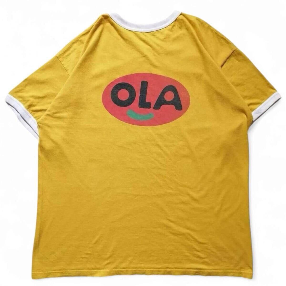 古着 リンガーT バックプリントTシャツ 「OLA」 RINGER TSHIRT USED アメカジ ヴィンテージ イエロー 黄色 メンズL相当 / 1544拍卖