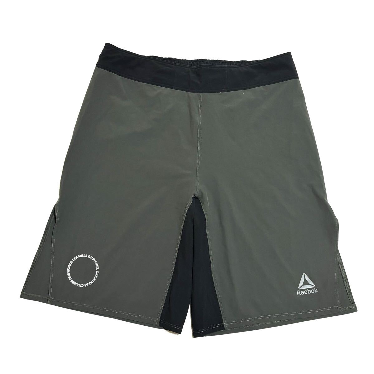 【美品】Reebok LESMILLS リーボック レズミルズ ボディコンバット ショーツ ハーフパンツ ストレッチ ドライ 速乾 オリーブ×黒 メンズ 31拍卖