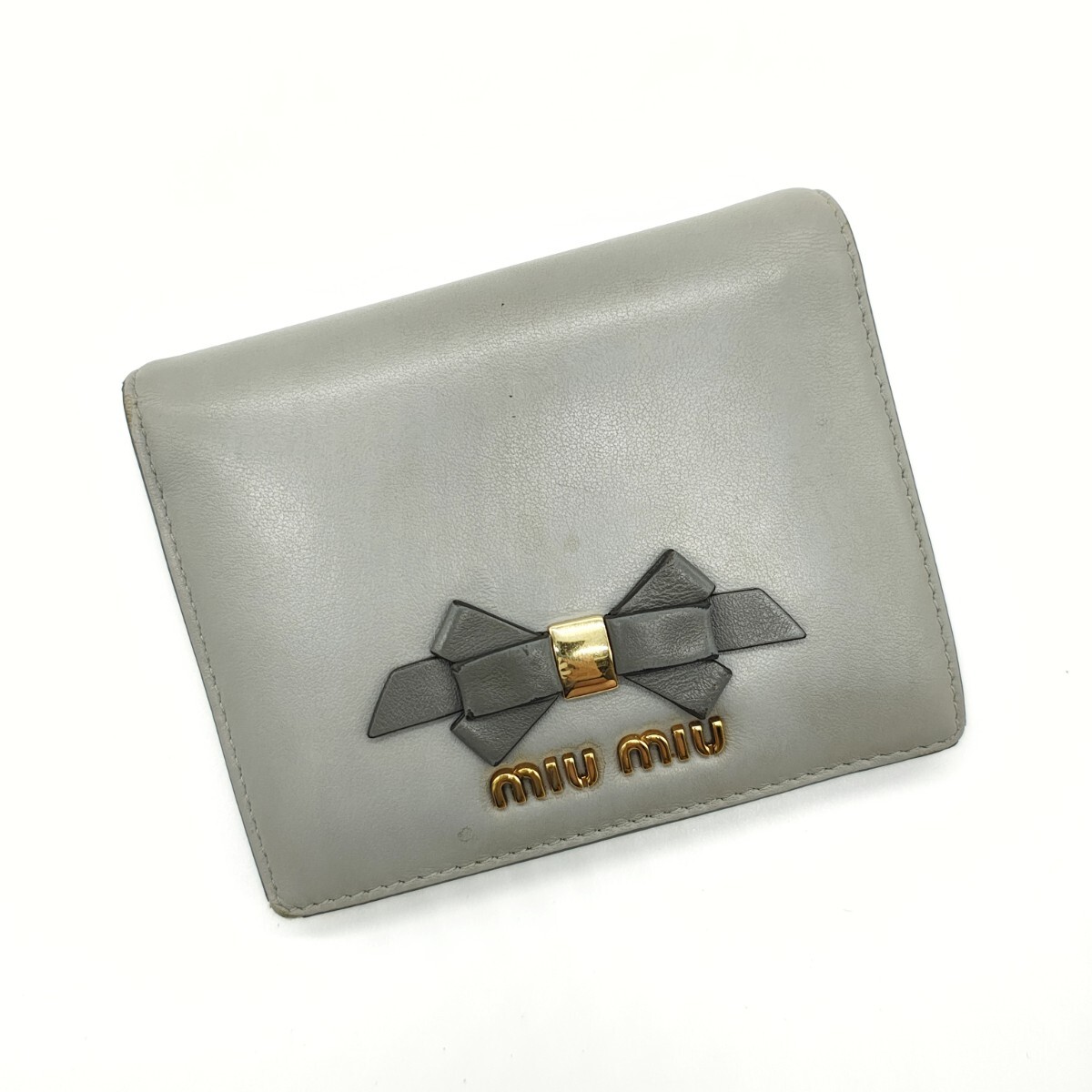 ミュウミュウ 折り財布 ゴールドロゴ リボン レザー グレー miumiu拍卖