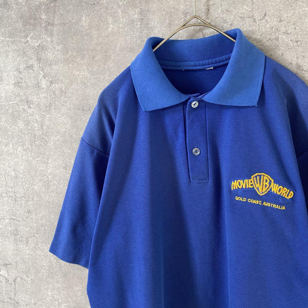 90sWarner Brosポロシャツ 青 ゴールドコースト メンズMサイズ拍卖