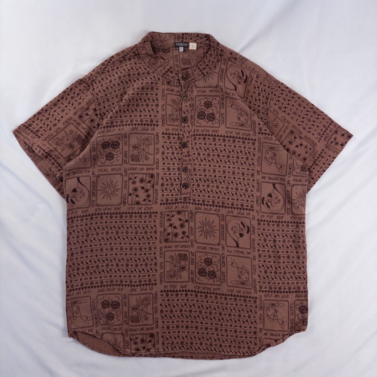 US Vintage EARTH BOUND コットン100% バンドカラー ハーフボタン プリミティブ 象形 エスニック 民族 アート ココナッツボタン 総柄シャツ拍卖