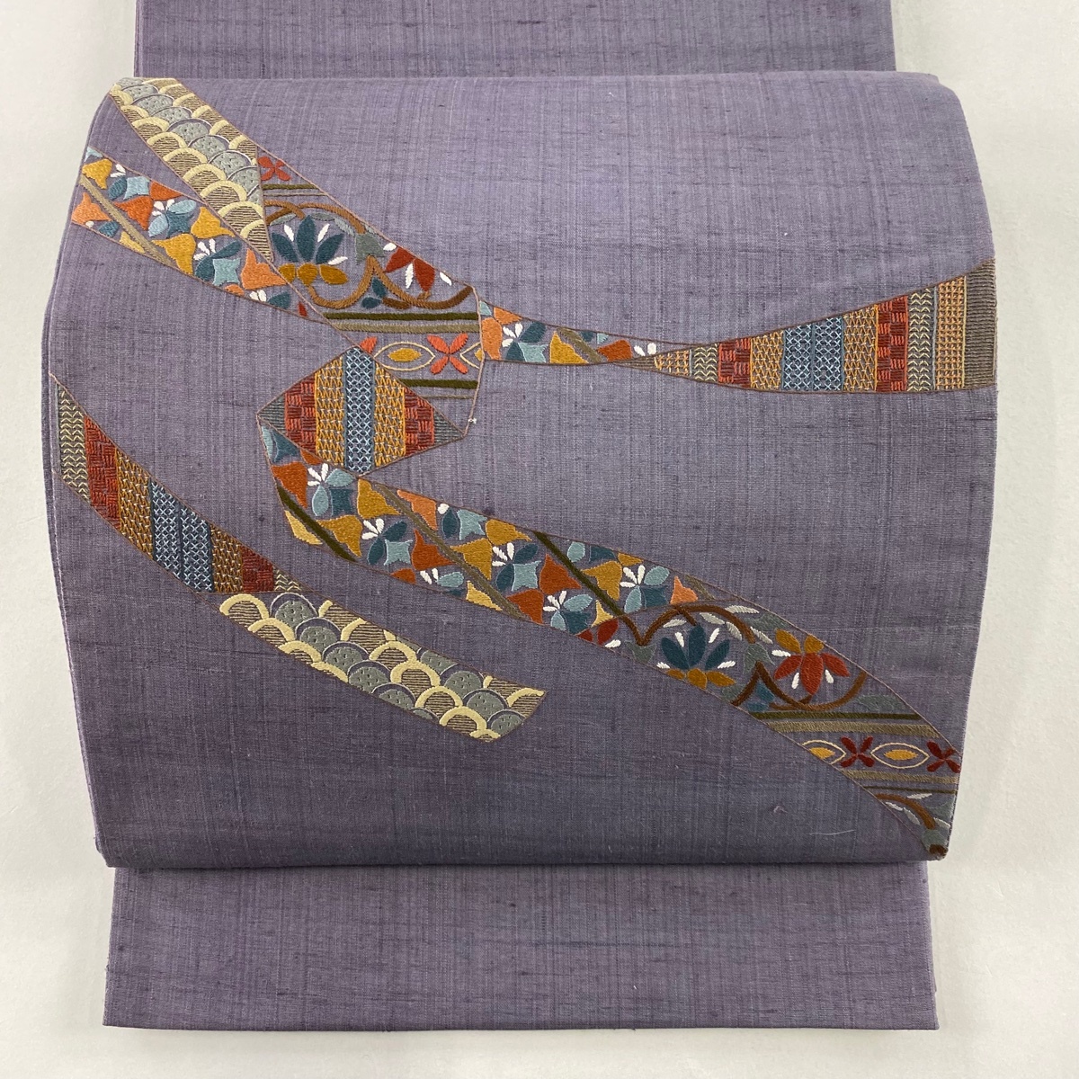 袋帯 秀品 紬地 蔓帯 草花 刺繍 紫 お太鼓柄 正絹 【中古】拍卖