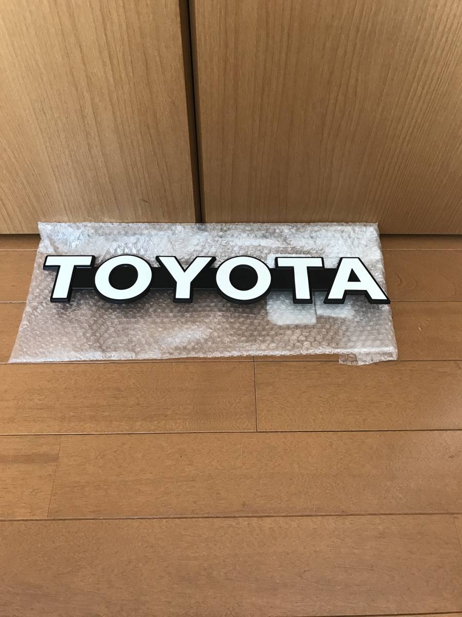 トヨタ・ランドクルーザー70系フロントグリル・N60系ハイラックスサーフ1985-1987年エンブレム、新品..拍卖