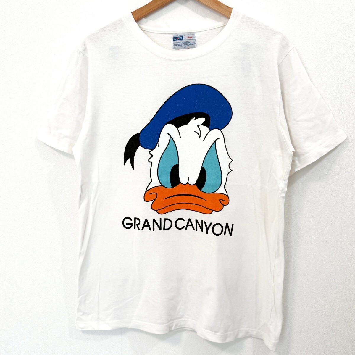 f3703iL GDC/GRAND CYANION グランドキャニオン サイズL 半袖Tシャツ ドナルドダック ディズニー プリントTシャツ ホワイト 白 メンズ 古着拍卖