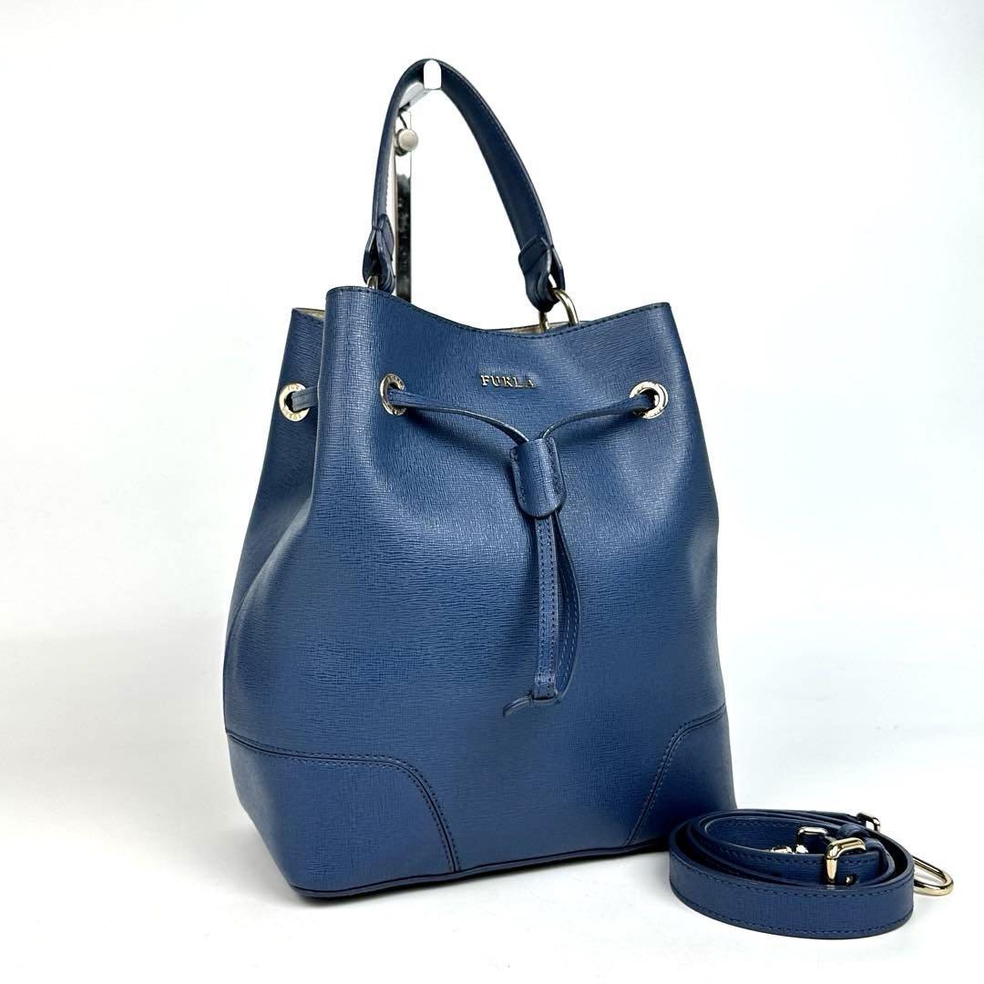 美品●FURLA フルラ ステイシー ハンドバッグ 2way ショルダーバッグ ロゴ 巾着 斜め掛け サフィアーノレザー 青色 ブルー フォーマル拍卖