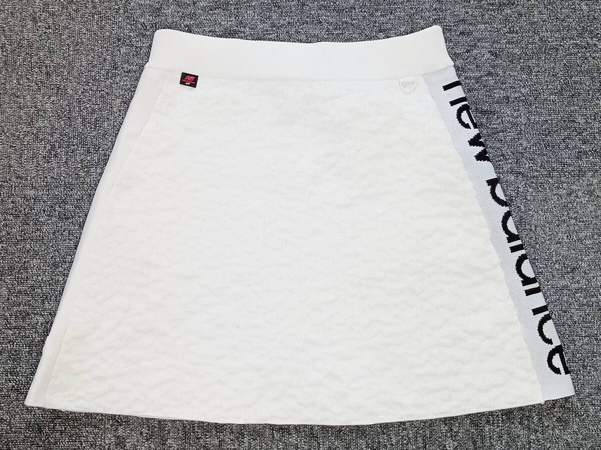 美品!価格14300円 new balance golf ニューバランスゴルフ リキッドカモフラージュ 秋~冬モデル ニットスカート(白1=L相当)拍卖