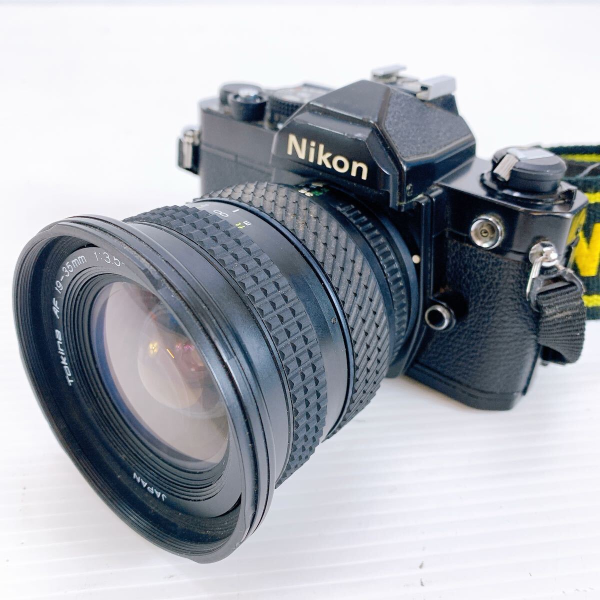 Nikon ニコン FM 3149124 フィルムカメラ レンズTokina トキナ AF 19-35mm 1:3.5-4.5 人物 動物 風景 カメラ 光学機器 拍卖