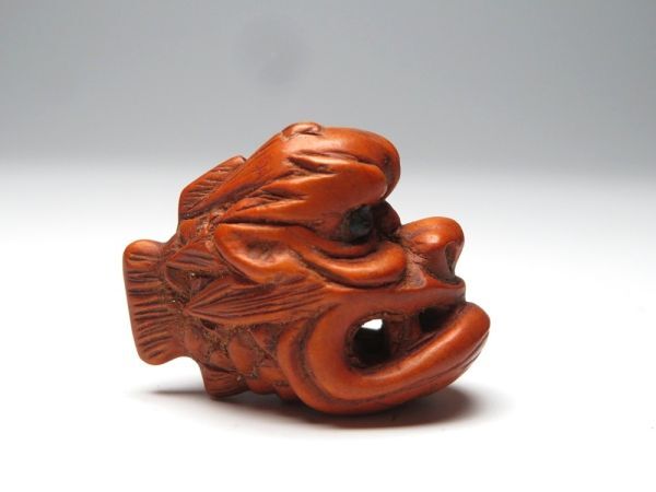 【11531】明治期 堤物 木製 人面魚 緒締(初品・買取品)拍卖