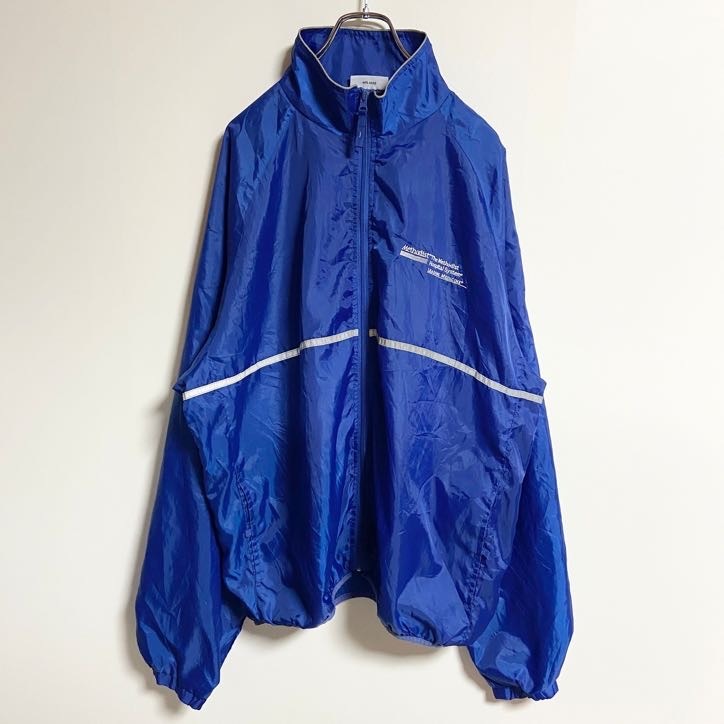 古着 used 長袖ジップアップナイロンジャケット ワンポイント刺繍 企業ロゴ 青 ブルー ビッグシルエット 秋冬服 XLサイズ拍卖