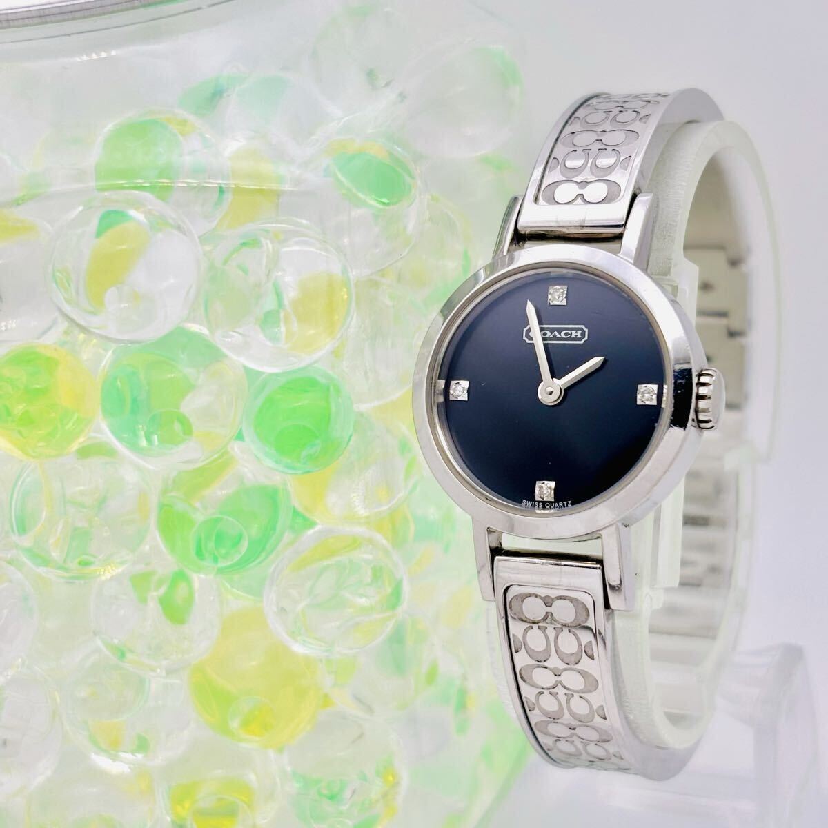 【新品電池】COACH コーチ 4Pダイヤ レディース 腕時計 シルバー シグネチャー バングル 8.603.857 0277拍卖