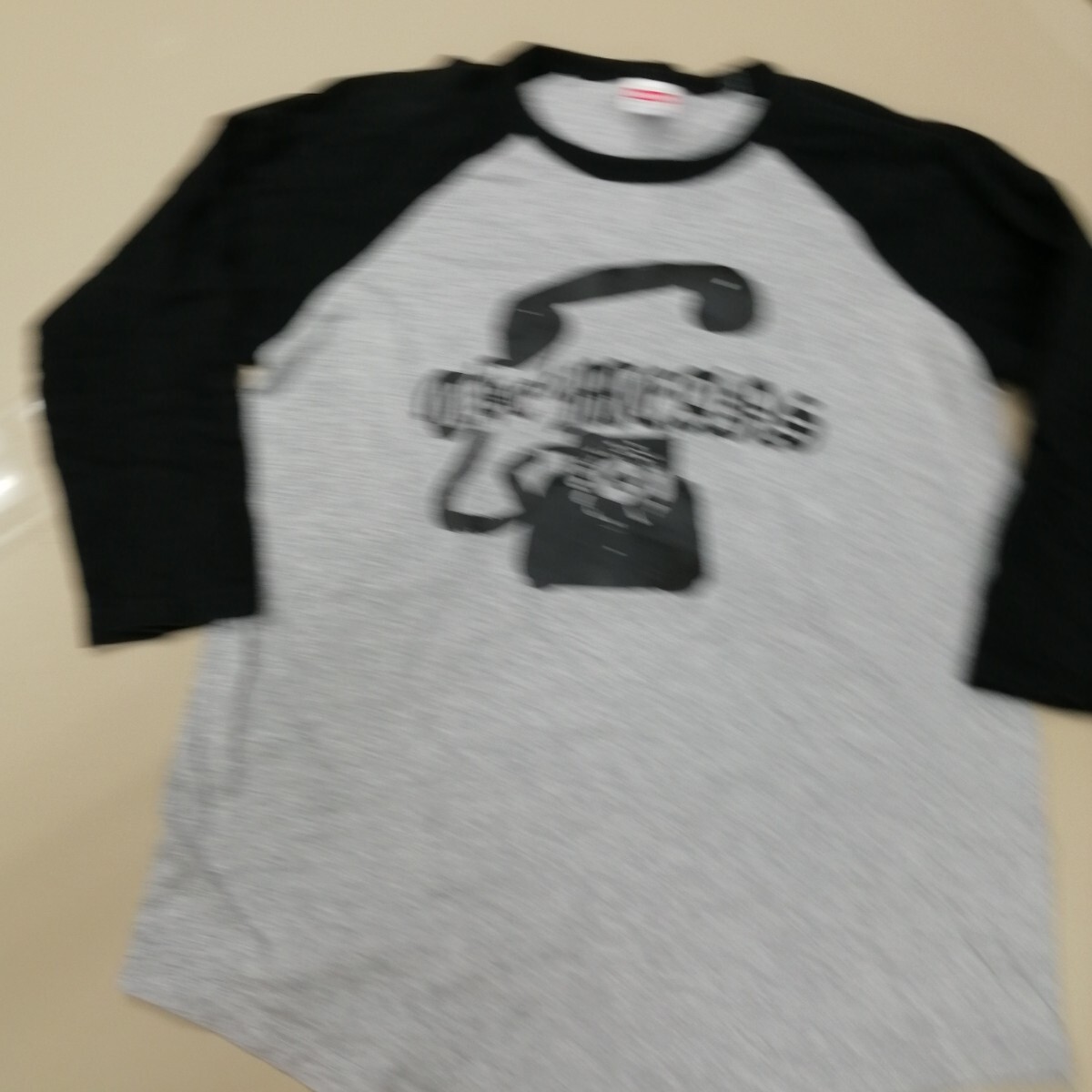 E09 バンドTシャツ ミーンズ THE MEANS ラグラン 七分袖 杢グレー×黒拍卖