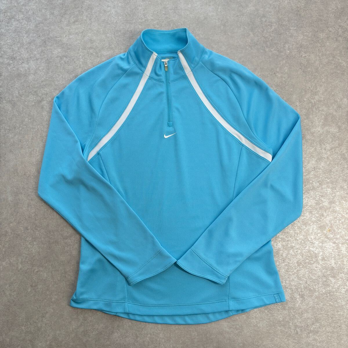 レディース NIKE ナイキ 長袖ハーフジップ シャツ トレーニング 刺繍ワンポイントロゴ 水色 Lサイズ拍卖