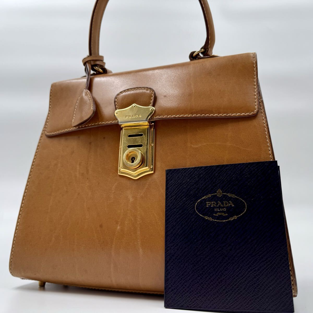 超希少モデル■ PRADA プラダ ハンドバッグ トップハンドル ロック金具 鍵付き ボックス 最高級 カーフ レザー キャメル ブラウン拍卖