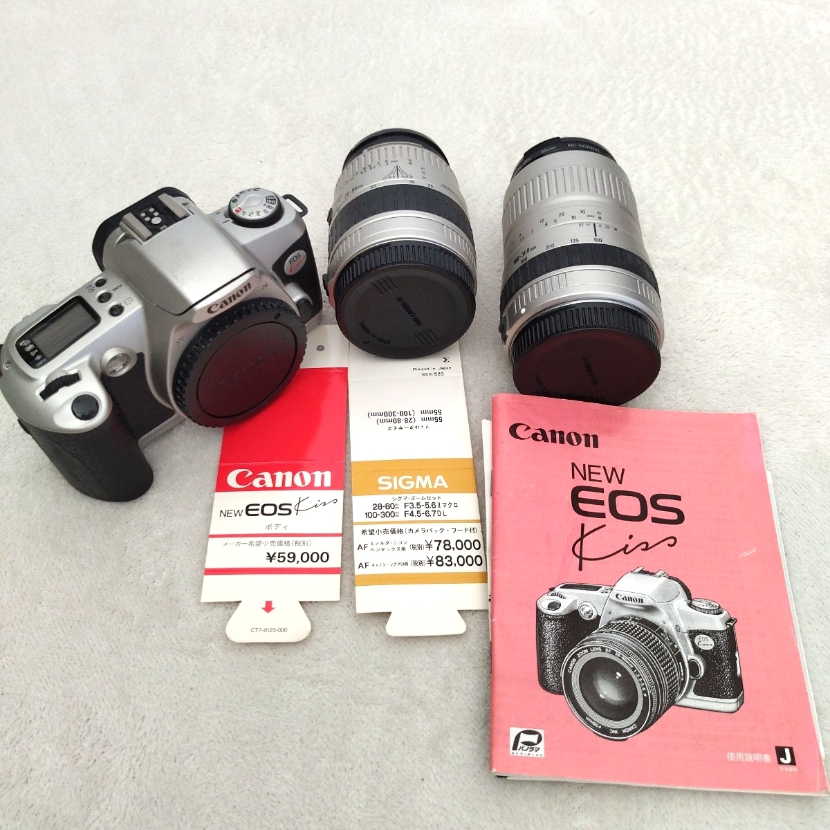 Canon EOS Kiss キャノン フィルムカメラ 短い方のレンズはジャンクです 長い方のレンズでシャッター切れました お直し、部品取り前提拍卖