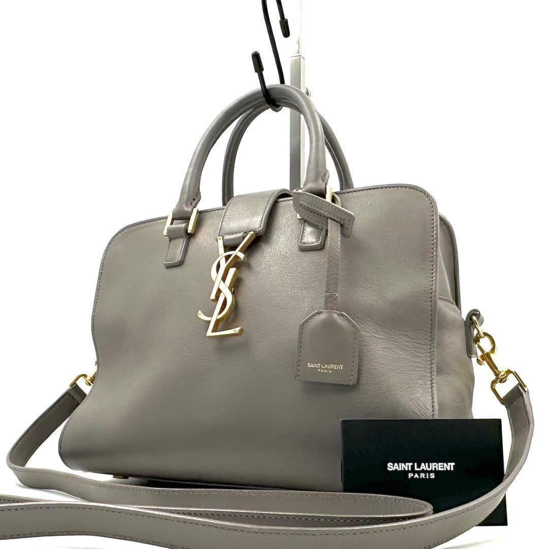《美品》SAINT LAURENT PARIS サンローランパリ ベイビーカバス レザー 2WAY ハンドバッグ ショルダーバッグ グレー チャーム付拍卖