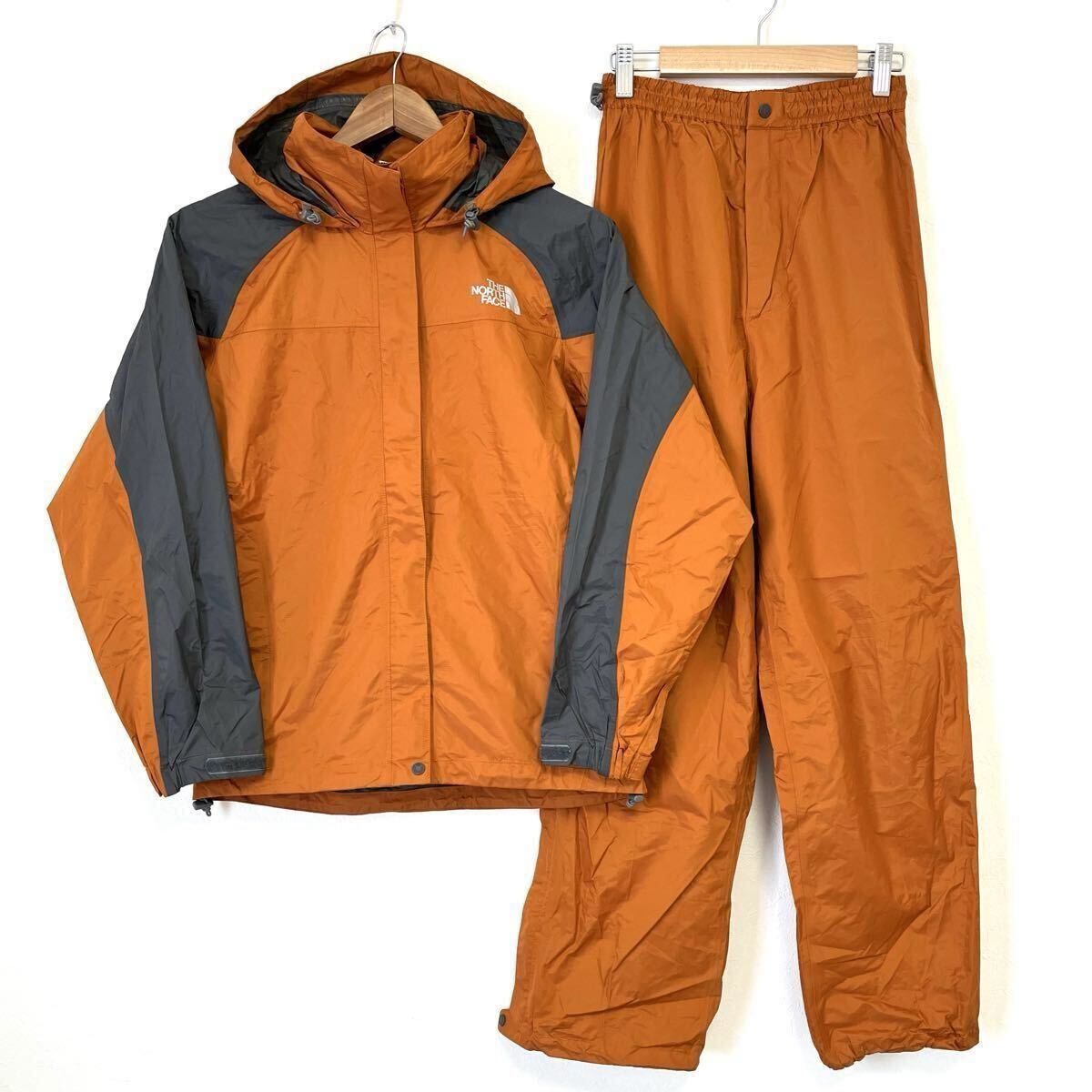 W761【THE NORTHFACE】ザノースフェイス セットアップ レイン ジャケット パーカー パンツ 上下 セット 収納袋付 アウトドア オレンジ M/mm拍卖