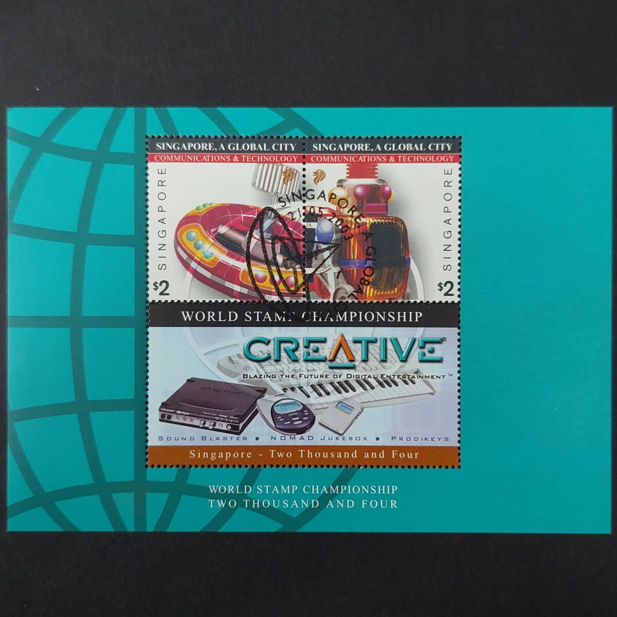 L061 シンガポール切手「『2004年シンガポール第1回切手世界選手権』記念小型シート 企業:クリエイティブ・テクノロジー」2003年 消印有拍卖