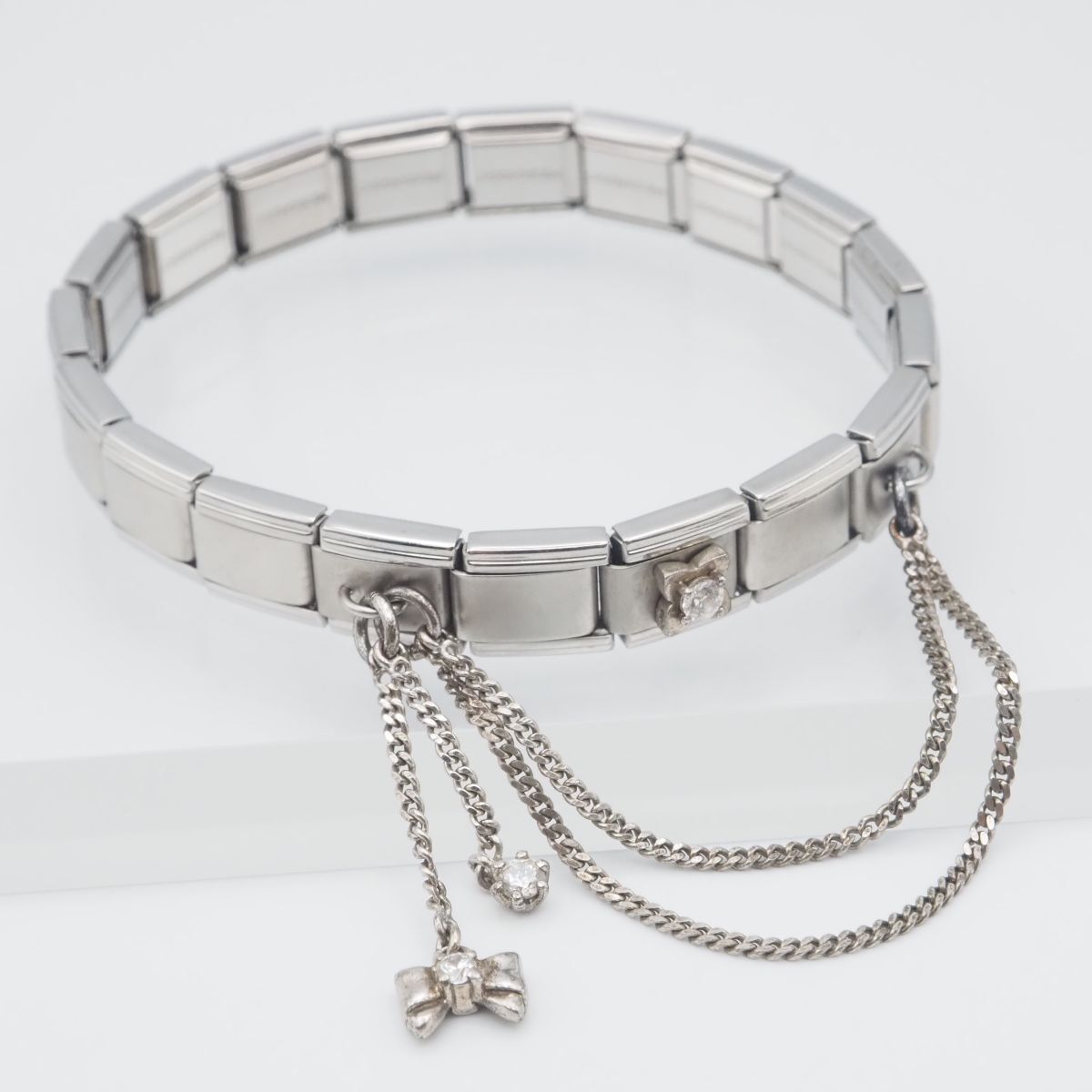 F474 MESSAGGIO メッサジオ ブレスレットダイヤモンド風 チェーン リボン デザイン シルバー拍卖