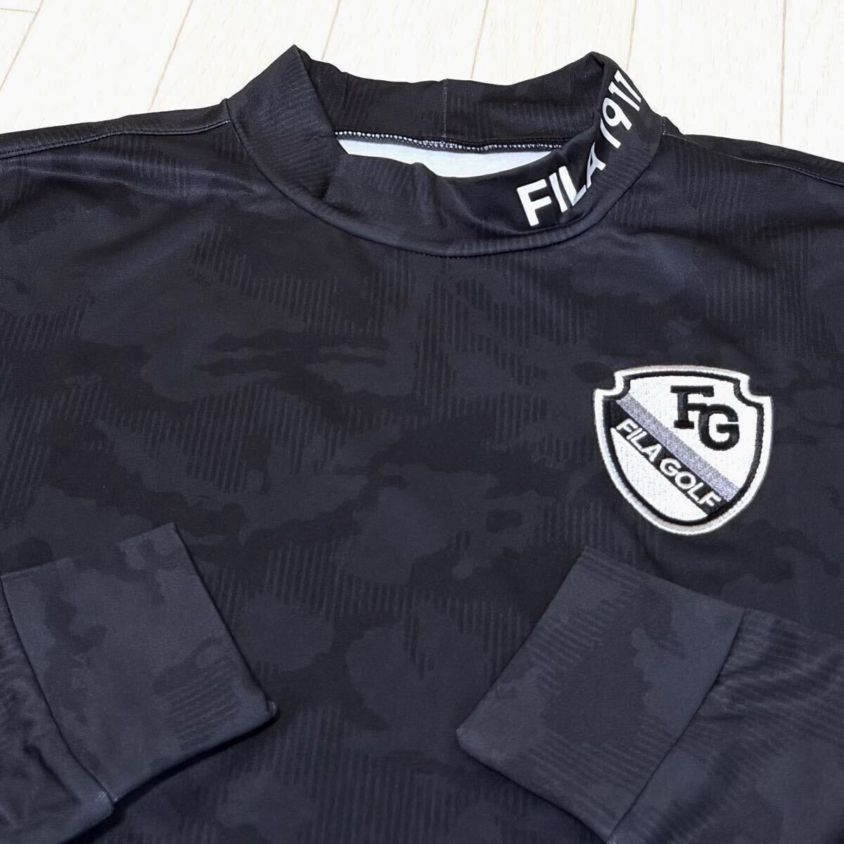 新品★フィラ ゴルフ FILA GOLF カモ柄 左胸FGエンブレム 裏微起毛 保温 長袖モックネックシャツ★ブラック★サイズLL拍卖