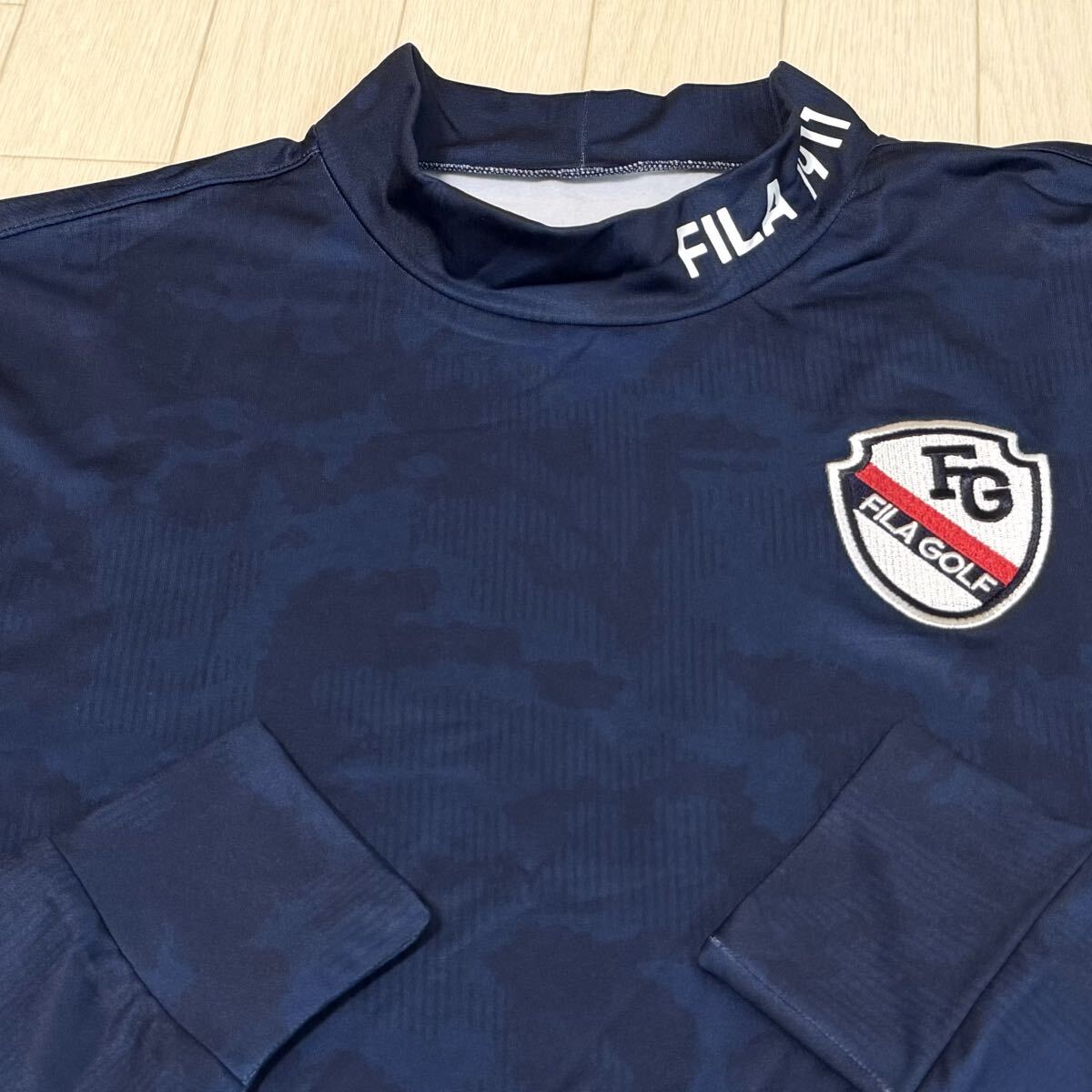 新品★フィラ ゴルフ FILA GOLF カモ柄 左胸FGエンブレム 裏微起毛 保温 長袖モックネックシャツ★ネイビー★サイズLL拍卖