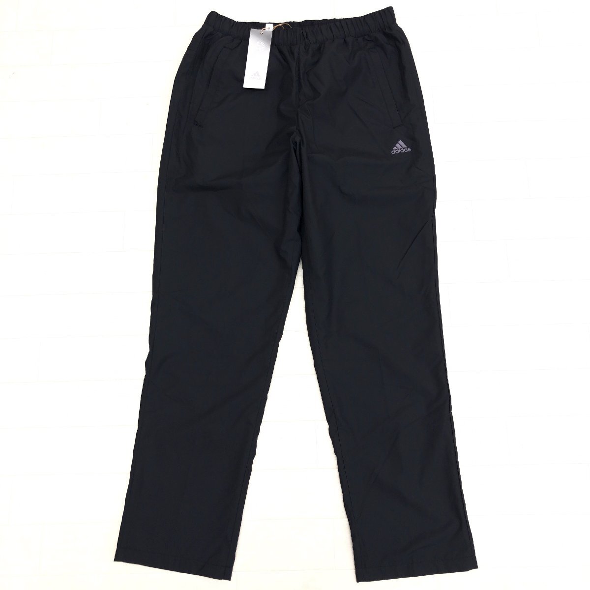 新品 adidas アディダス 定価6,600円 蓄熱裏地 ロゴプリント ウインドブレーカー パンツ L 黒 ジャージ トラックパンツ レディース未使用拍卖