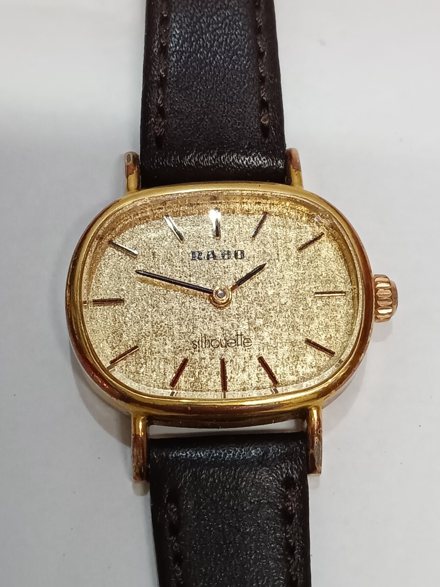 RADO レディース 腕時計 クォーツ Silhouette A5053757 手巻き 稼働 ラドー ゴールド文字盤 レザーベルト拍卖