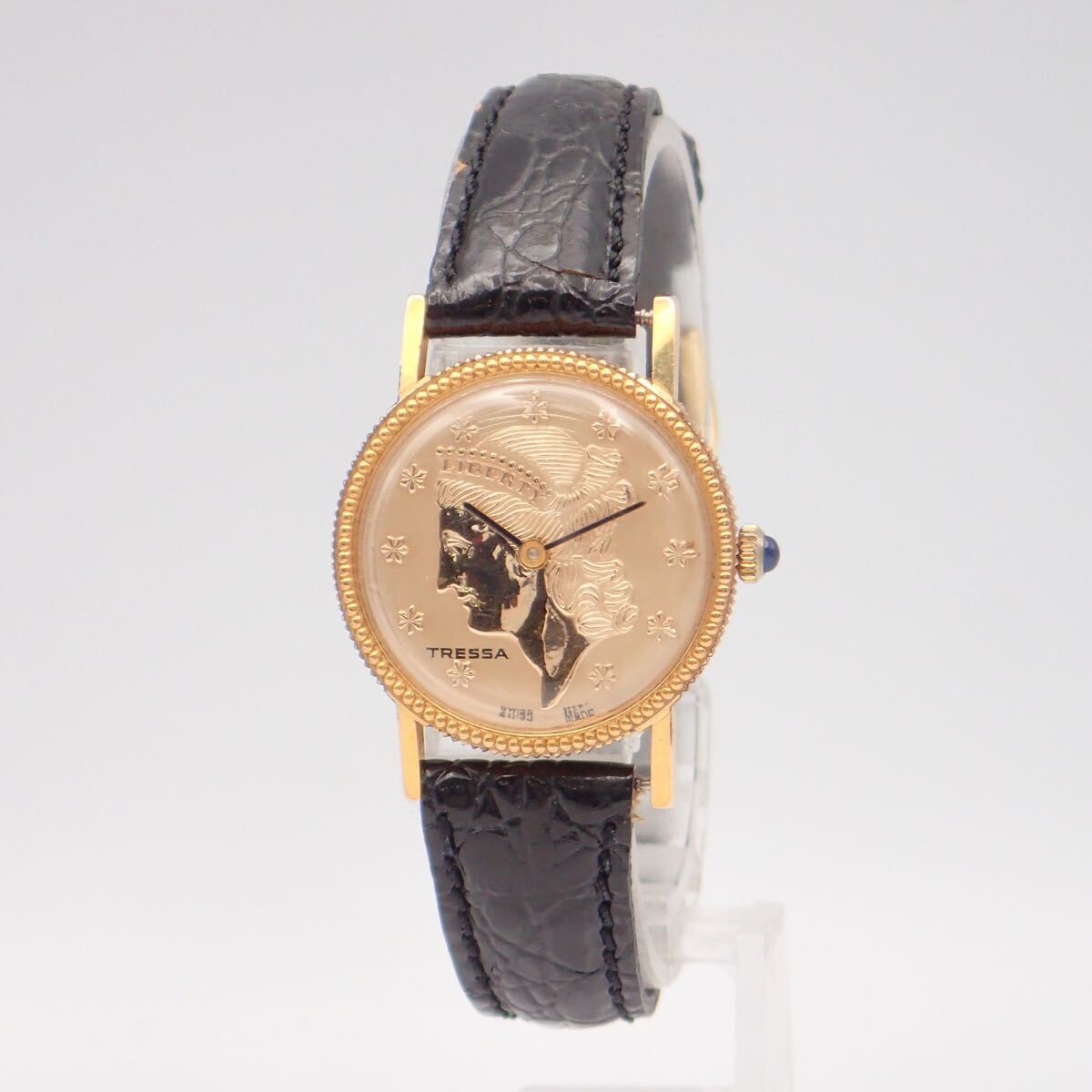 お09447 TRESSA トレッサ コインウォッチ リバティ ゴールド文字盤 青石リューズ レディース 腕時計 手巻き 稼動拍卖