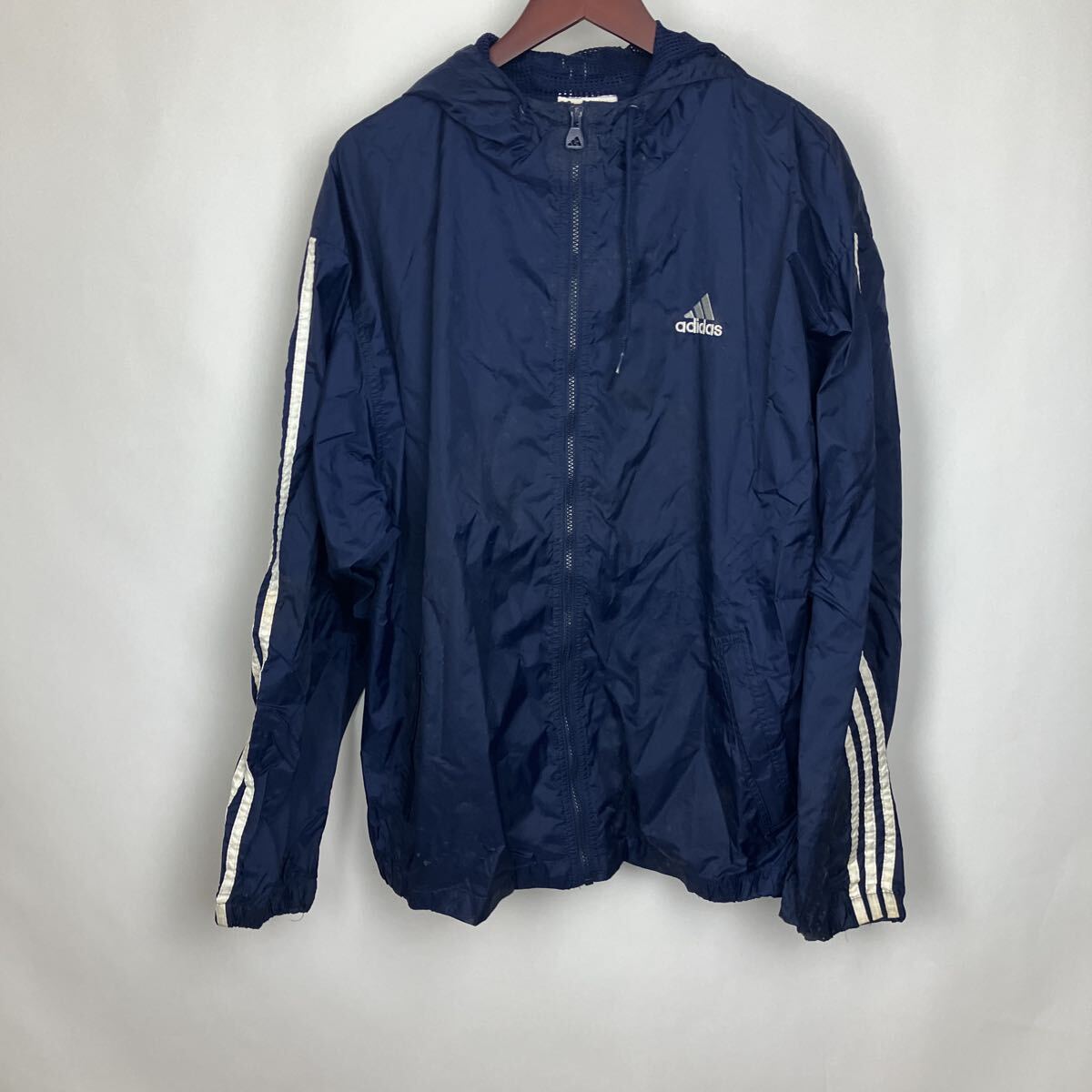アディダス adidas ネイビー ナイロンジャケット ジャケット ウィンドブレーカー トップス ジップアップ 紺色 ワンポイント拍卖