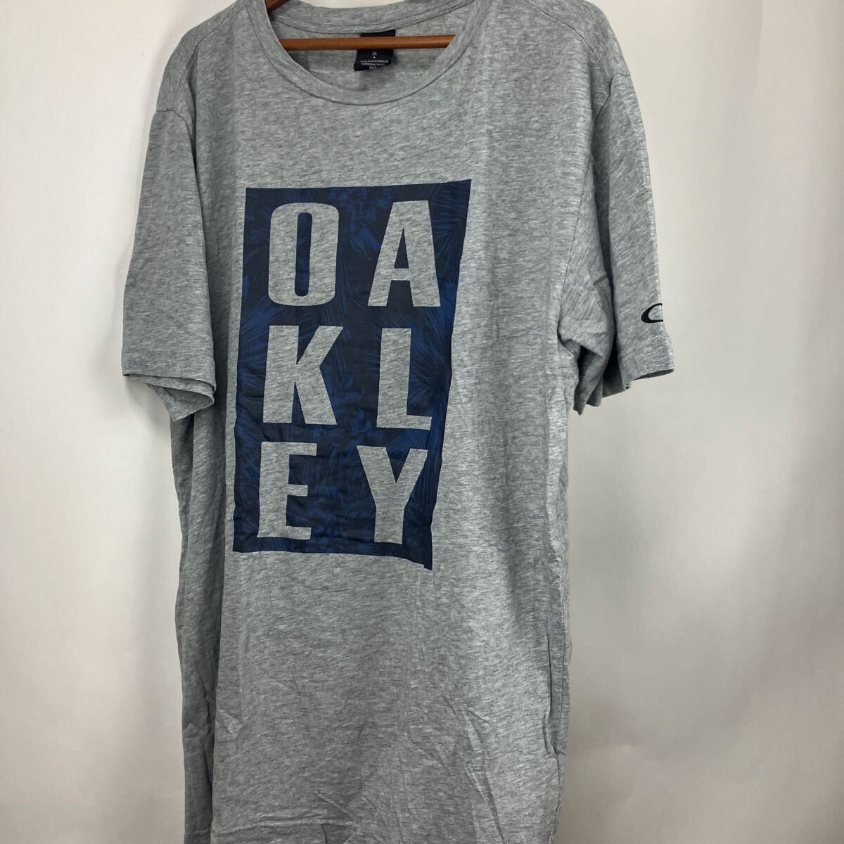 オークリー OAKLEY グレー 半袖Tシャツ 半袖 Tシャツ 半袖カットソー トップス アメリカ古着 コットン XL ロングTシャツ スポーツ拍卖