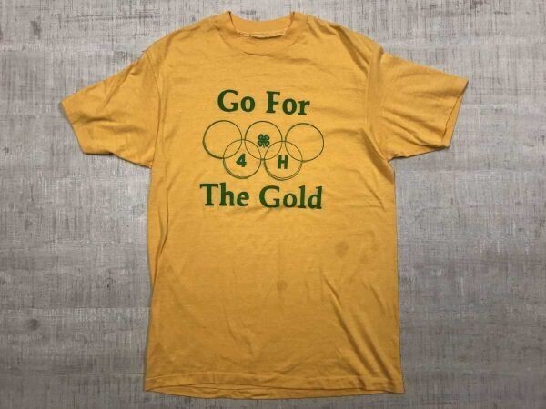 オールド レトロ スポーツ 90s US古着 シングルステッチ Go For The Gold 英字 クローバーロゴ プリント 半袖Tシャツ メンズ オレンジ拍卖
