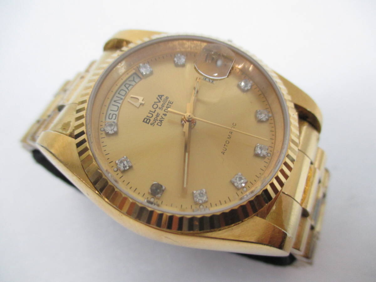 ☆【KH⑥-80】BULOVA/ブローバ SUPER SEVILLE スーパーセビル DAY&DATE 3針デイデイト 自動巻 10P ゴールドカラー 動作品☆拍卖